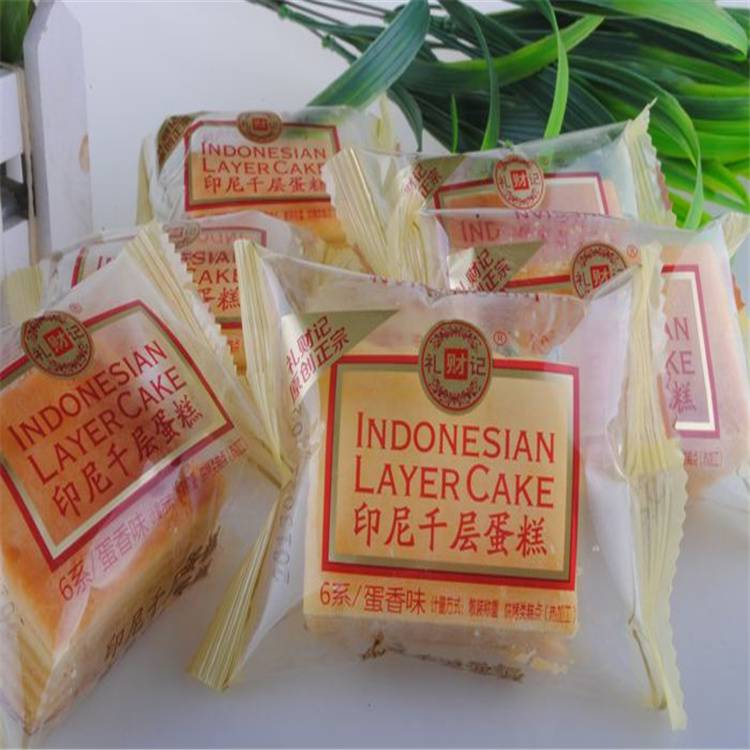 上海钦典QD250型把手塑料块三角插头枕式包装机