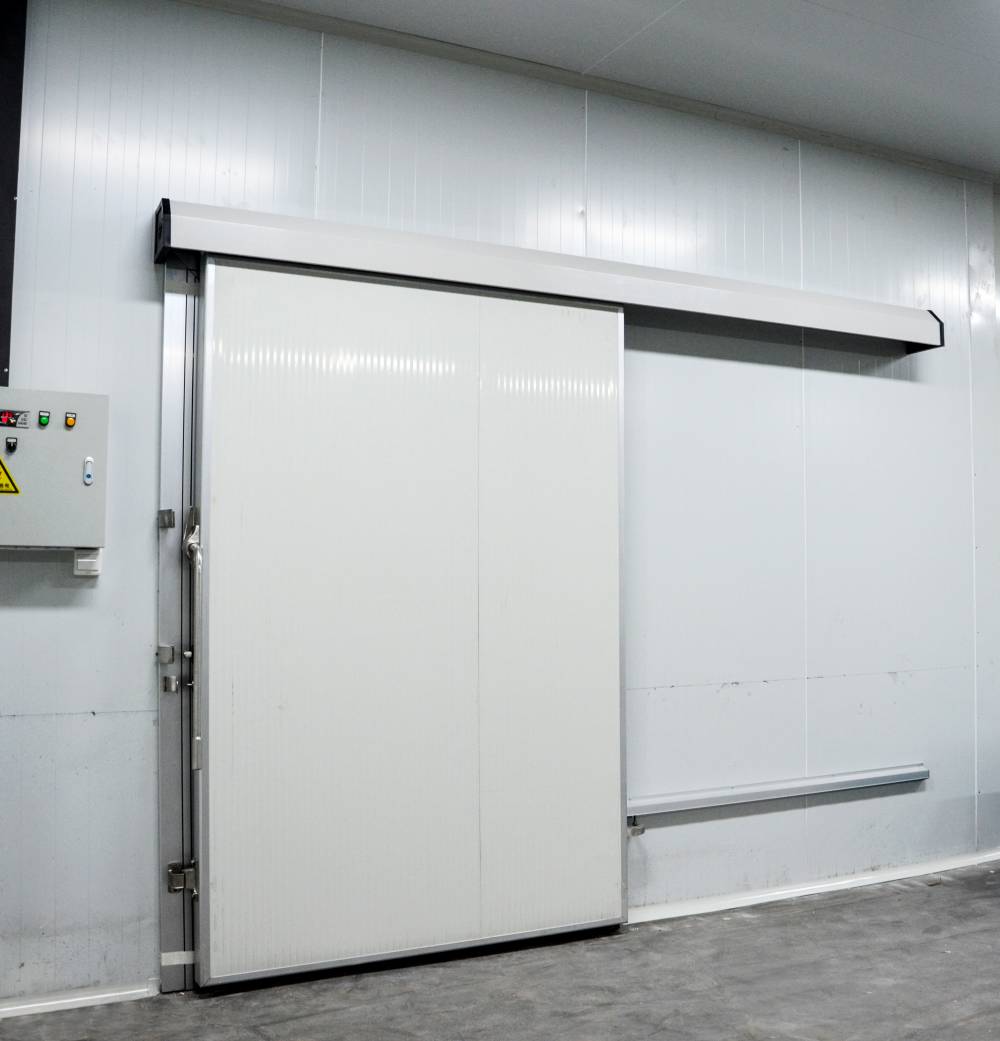 天津铝包边彩钢手动冷库平移门