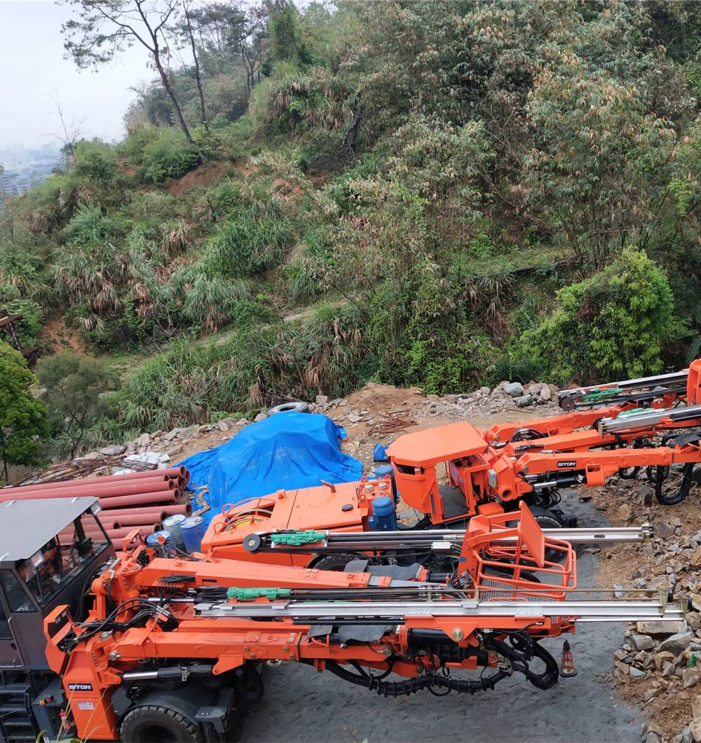 鑫通dw2100轮胎式双臂带吊篮掘进凿岩台车