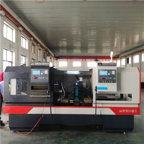 自动化双头镗孔平头机恒兴非标自动化双头车床托辊轴两端平头倒角机