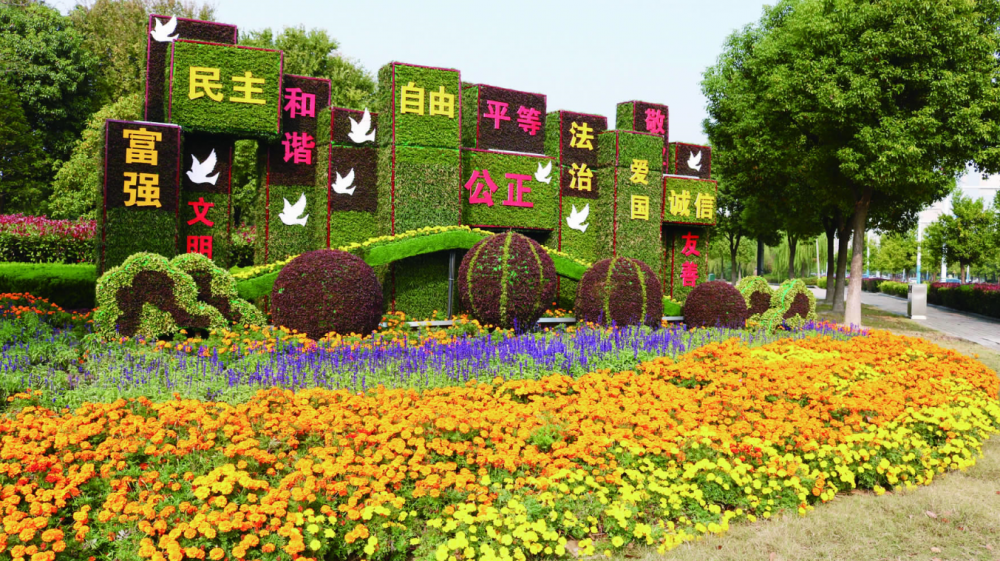 江西南昌仿真春节绿雕户外公园主题雕塑仿真绿雕牛造型图片