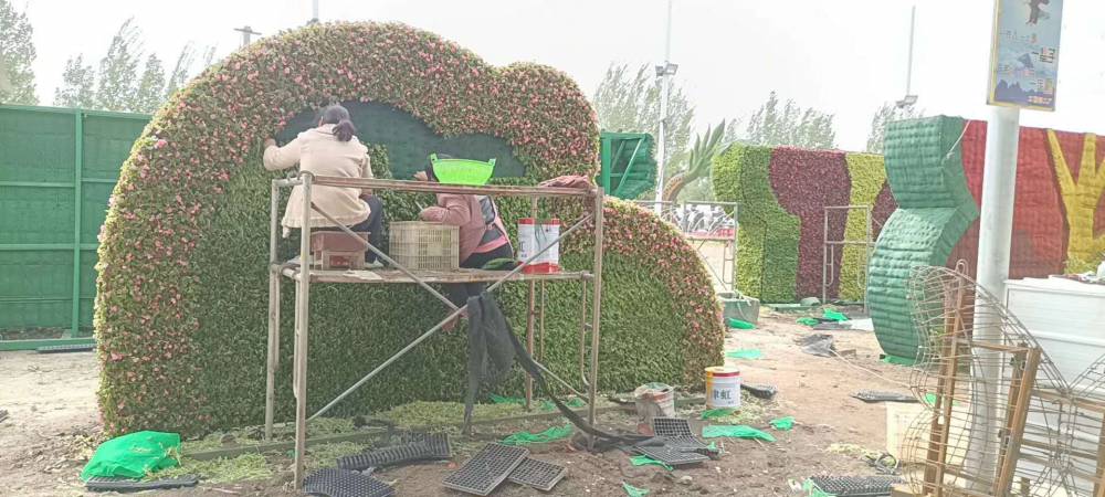 重庆市绿雕景观制作 ,彩虹仿真花雕大型动物仿真绿雕定制