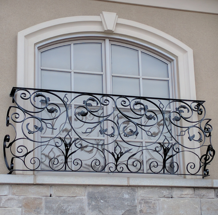 工厂订做铁艺防盗窗及各种铁艺栏杆图片