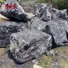 公园草坪黑山石点缀，黑山石产自广东英德，新式水钵喷泉设计