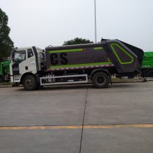 解放牌12方压缩垃圾清运车 带簸箕斗压缩垃圾车价格