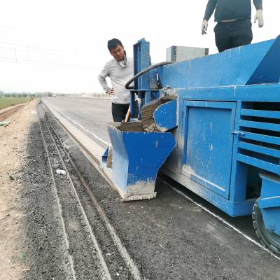 路肩石浇筑滑膜机 马路牙子自动滑模机 自走式护肩石成型机