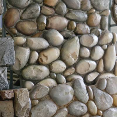 安徽巢湖pu堡垒石的性能特点酒吧歌舞厅仿真鹅卵石背景墙款式定制