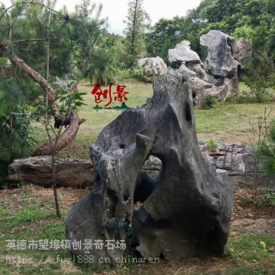 公园草坪点缀太湖石，广东出售假山工程石材，别墅小区英德石奇石