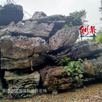 大英石又称假山石，园林假山英石制作，草地摆放大英石案例